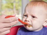 An adorable 8 month old baby boy reacting to the taste of green beans for the very first time.