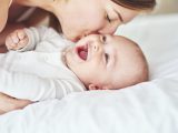 Shot of an adorable baby boy bonding with his mother at home