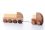 Small toy truck pulling another larger toy truck by a rope, both made of wood, with blocks to assemble.